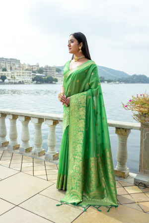 Parrot green color soft silk saree with zari weaving work