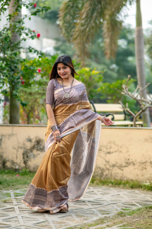 Beige color tussar silk saree with printed work