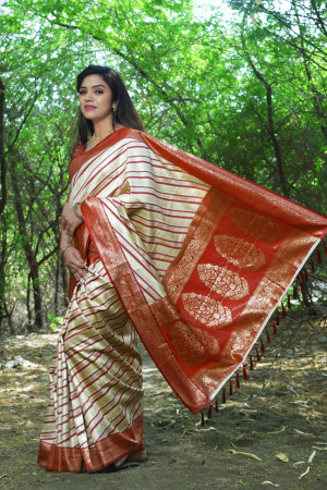 Off white color soft leheriya silk saree with zari weaving work