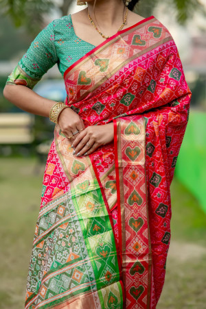 Pink color patola silk saree with zari weaving work