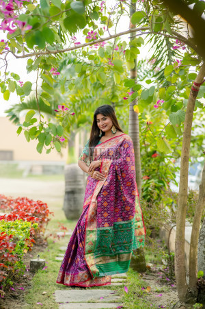 Magenta color patola silk saree with zari weaving work