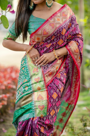 Magenta color patola silk saree with zari weaving work