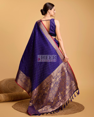 Violet color banarasi silk saree with zari weaving work