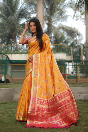 Yellow color soft organza silk saree with patola woven design