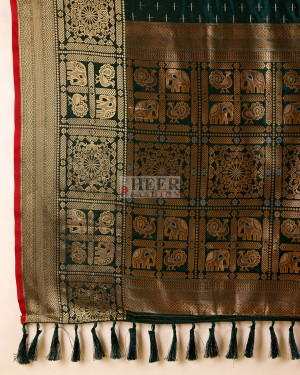 Bottle green color banarasi silk saree with zari weaving work