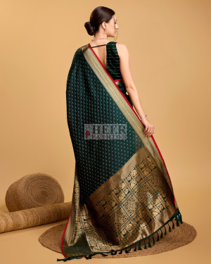 Bottle green color banarasi silk saree with zari weaving work