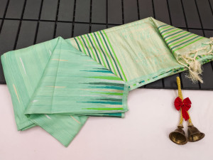 Sea green color soft tussar silk saree with zari woven work
