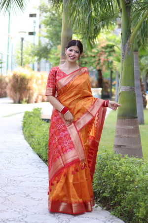 Orange color tussar silk saree with patola weaving design