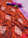 Dark orange color soft lichi silk saree with zari weaving work