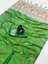 Parrot green color lichi silk saree with attractive silver zari weaving work