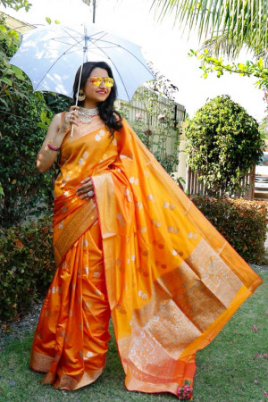 Orange color soft lichi silk saree with silver and golden zari weaving work