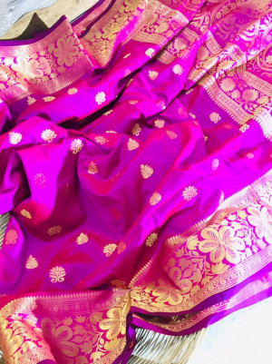 Rani pink color lichi silk saree with zari weaving work