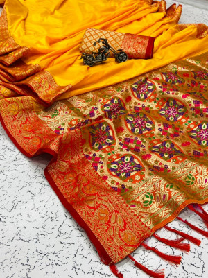 Yellow color soft banarasi silk saree with golden and silver zari work