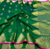 Green color banarasi silk saree with zari woven work
