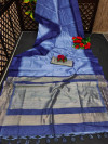 Blue color tussar silk saree with zari woven contrast border