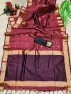 Maroon color raw silk saree with weaving work