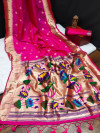 Rani pink color paithani silk saree with zari woven work