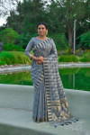 Gray color tussar silk saree with zari woven border