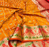 Orange color soft patola silk saree with weaving work