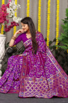 Purple color soft kanchipuram silk saree with zari woven work