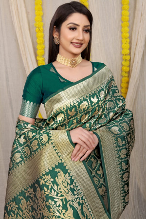 Dark green color soft kanchipuram silk saree with golden zari work
