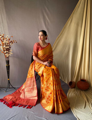 Orange color banarasi silk saree with weaving work