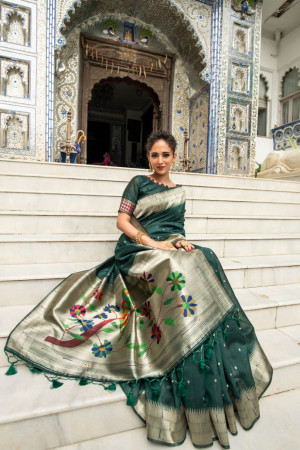 Dark green color paithani silk saree with zari woven border
