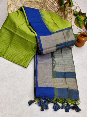 Parrot green color tussar silk saree with zari woven contrast border