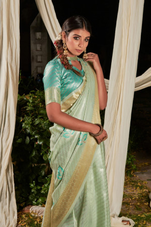 Pista green color soft linen saree with zari woven work