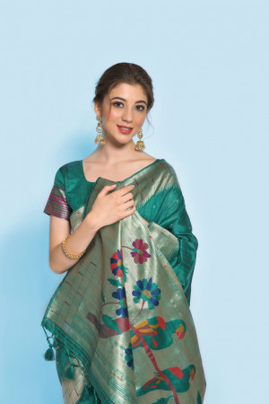 Rama green color paithani silk saree with zari woven border