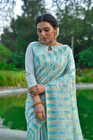Sea green color tussar silk saree with zari woven border
