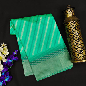 Sea green color tussar silk saree with zari woven work