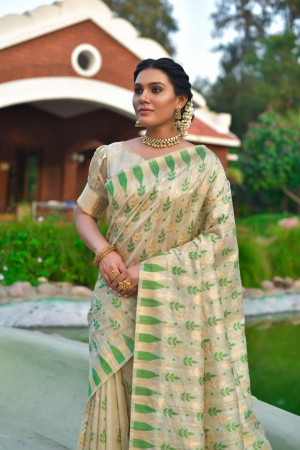 Off white color tussar silk saree with zari woven border