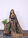 Dark green color patola silk saree with woven design
