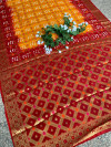 Yellow and red color hand bandhej silk saree with zari weaving work