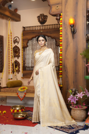 Off white color kanjivaram silk saree with zari weaving work