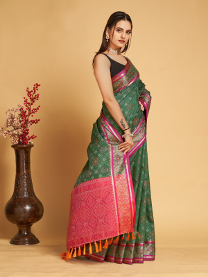 Dark green color patola silk saree with weaving work