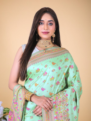 Pista green color banarasi silk saree with woven design