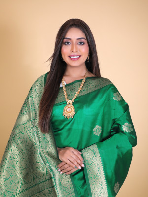 Green color soft banarasi silk saree with zari weaving work