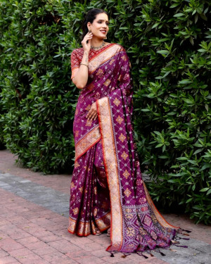 Magenta color patola silk saree with zari woven design