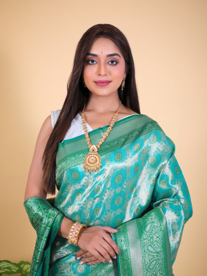 Green color tissue silk saree with zari weaving work
