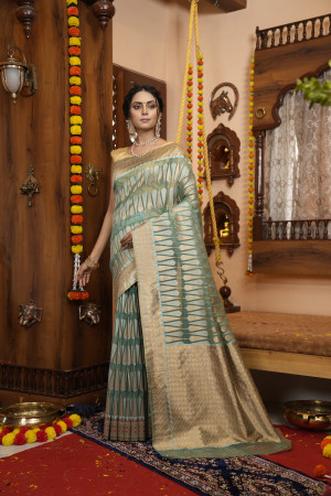 Sea green color soft organza silk saree with zari weaving work