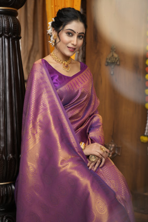 Purple color kanjivaram silk saree with zari weaving work