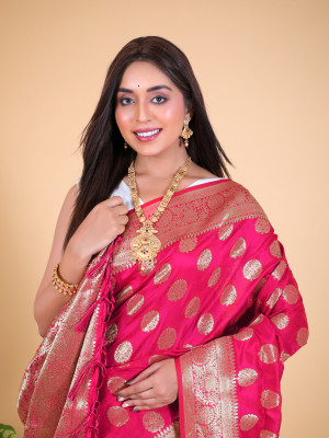 Rani pink color banarasi silk saree with zari weaving work
