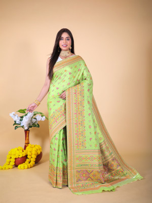 Mahendi green color banarasi silk saree with woven design