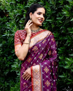 Magenta color patola silk saree with zari woven design