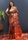 Maroon color soft patola silk saree with zari weaving work