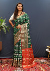 Green color soft patola silk saree with zari weaving work