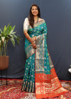 Rama green color soft patola silk saree with zari weaving work