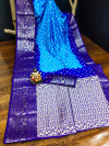 Sky blue and royal blue color bandhej silk saree with meenakari weaving work